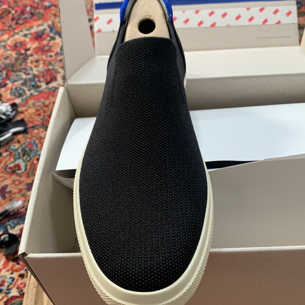 Brand new Rothy’s City slip on sneaker in black.